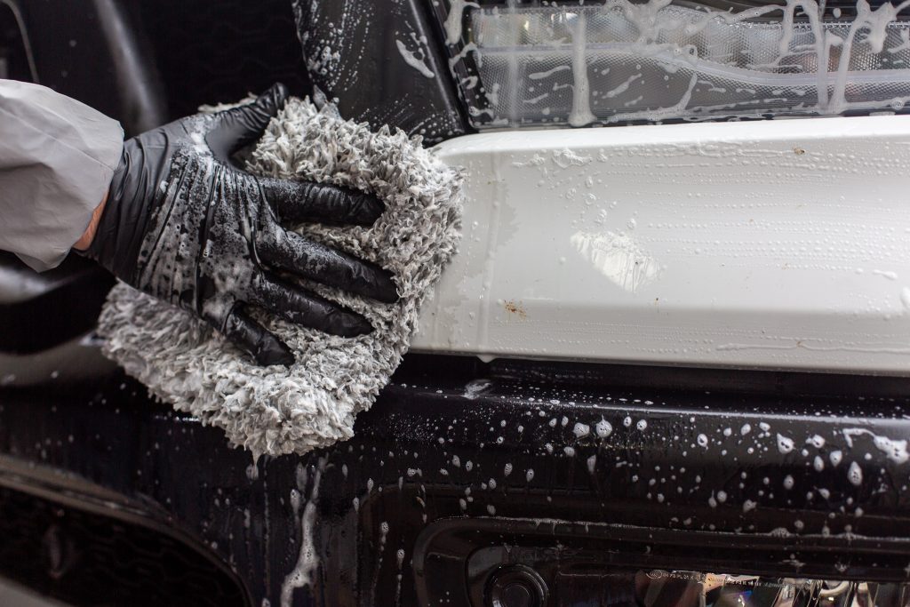 wiping with wash mitt