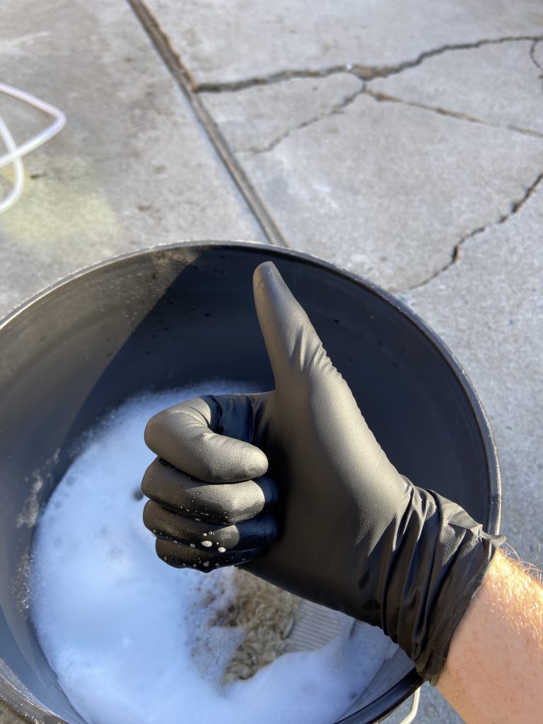 Winter washing tips hand with nitrile glove