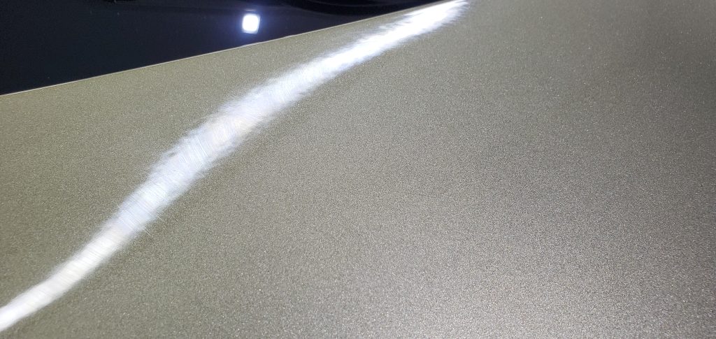 Rainbow effect on the surface once the coating is ready to be leveled.