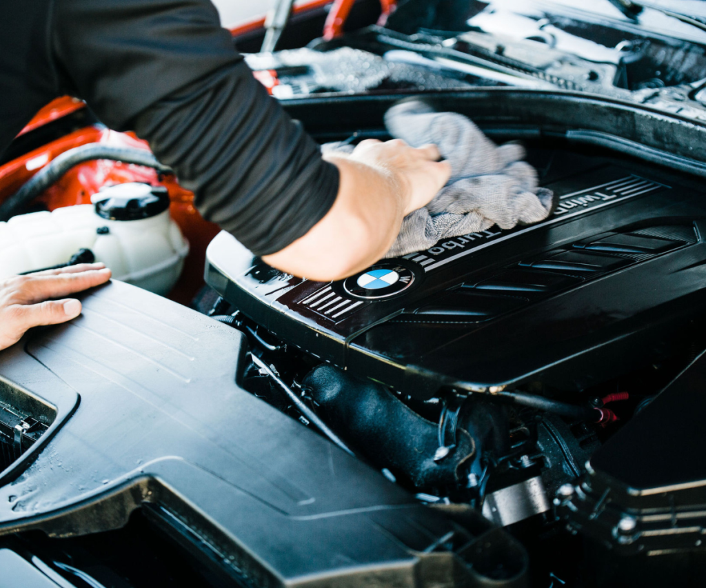 Image of cleaning and drying engine bay on BMW with Autofiber Dreadnought towel.