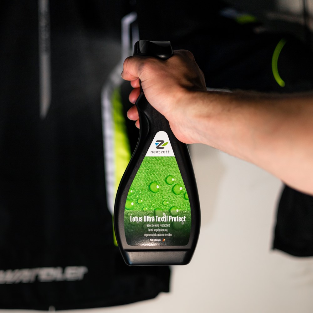 Nextzett Lotus Ultra Textil Protect spray onto car interior seats, upholstery