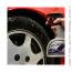 Spraying TUF SHINE Tire Cleaner